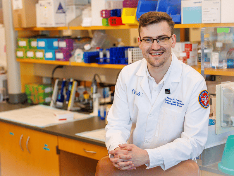 Nathan Campbell, who began working in laboratory research at UMMC as a high school student 11 years ago, is now graduating with a PhD in Experimental Therapeutics and Pharmacology.