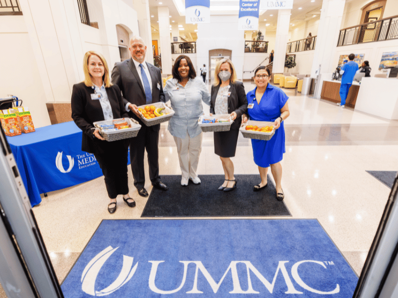 Ready to greet employees with fresh fruit and breakfast bars are, from left, University and Community Hospital CEO Dodie McElmurray, Adult Hospital Chief Nursing Officer Jason Zimmerman, Director of Employee Relations Cecelia Bass, Deputy General Counsel Stephanie Jones and Talent Acquisition Coordinator Jessica Quiroz as part of Employee Appreciation Week