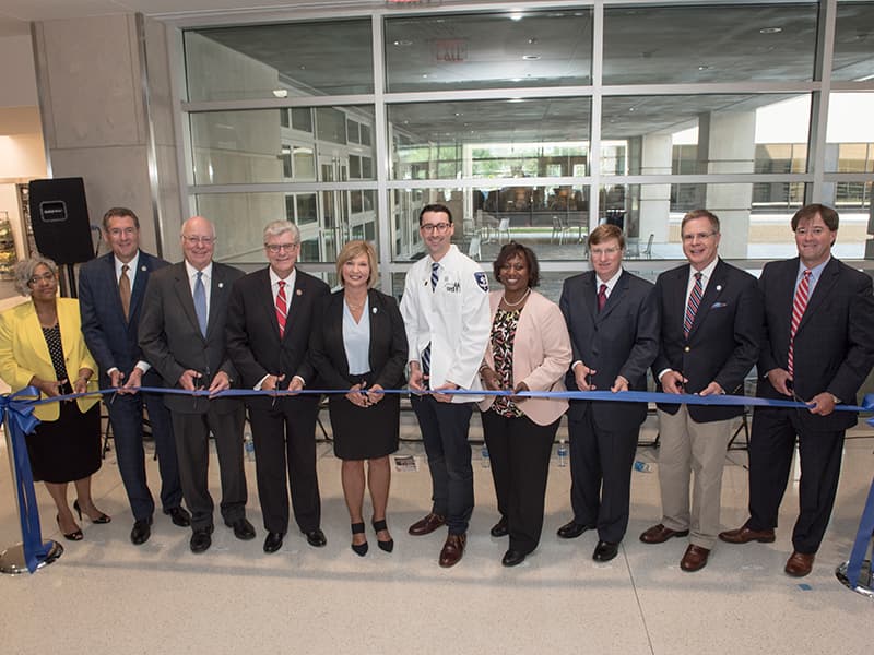Cutting a ceremonial ribbon at the dedication of the new School of Medicine are, from left, UMMC chaplain Doris Whitaker, U.S. Rep. Gregg Harper, Dr. James Keeton, Gov. Phil Bryant, Dr. LouAnn Woodward, Johnny Lippincott, Dr. Loretta Jackson-Williams, Lt. Gov. Tate Reeves, Chancellor Jeffrey Vitter and Dr. Ford Dye.