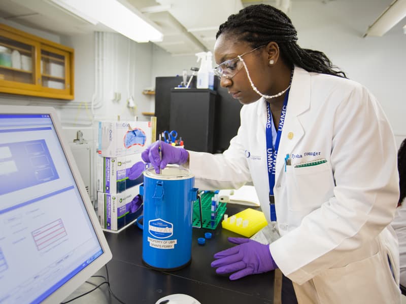 Tyesha Younger, a biorepository specialist, checks super-chilled samples in UMMC's biobank. UMMC was selected as an enrollment site for All of Us, an NIH-sponsored study that will collect health data and specimens from one million Americans.