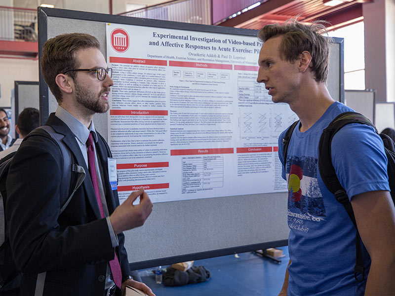 Jeremiah Blough, left, a graduate student in the School of Applied Sciences, discusses his research with Jeremiah Reese, a first-year medical student during a poster session.