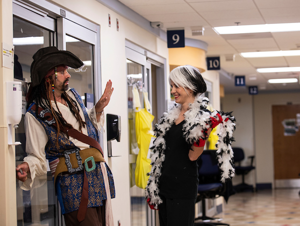 Chief of pediatric critical care Dr. Jarrod Knudson, dressed as Capt. Jack Sparrow, consults with Cruella De Vil, aka PICU nurse manager Shelly Ivers Craft.