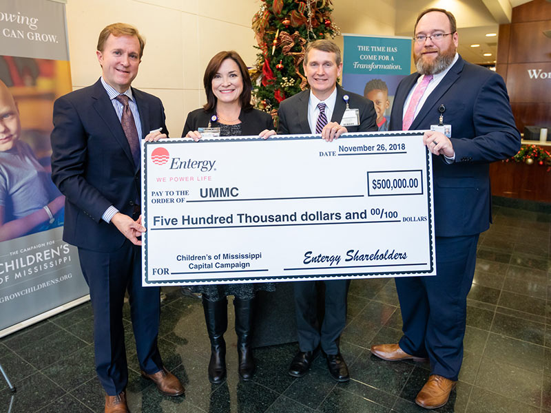 Holding a ceremonial $500,000 donation check to the Campaign for Children's of Mississippi are, from left, Entergy Mississippi president and CEO Haley Fisackerly, Dr. Mary Taylor, chair of Pediatrics, Guy Giesecke, CEO of Children's of Mississippi and Jonathan Wilson, UMMC Chief Administrative Officer.