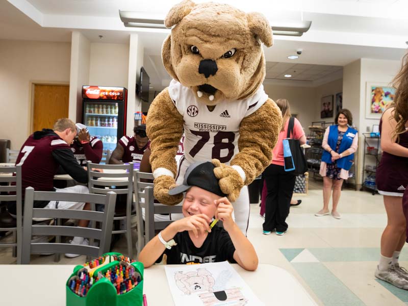 Photos: Football players kick off fun for Children’s of Mississippi patients