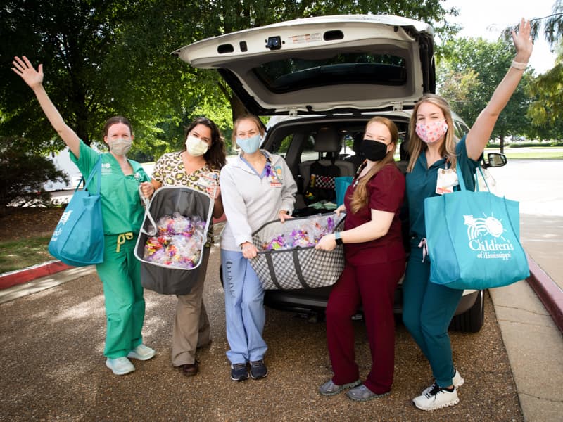 Nurses on 5C donated more than 300 goodie bags for Jackson Public Schools students and read stories to them as they picked up packets for distance learning. From left are Kayleigh Moore, Julia Joseph, Blake Fulton, Laura King and Kelley Wood.