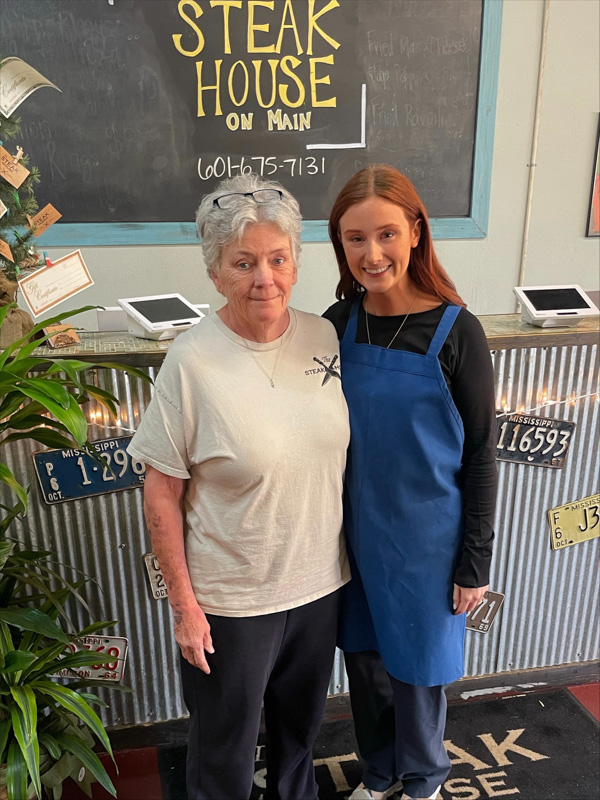 Makenzie Downs and her mom, Sheila Downs, manage to stop and take a breath at the family's busy restaurant in Mendenhall. (Photo courtesy of Makenzie Downs)