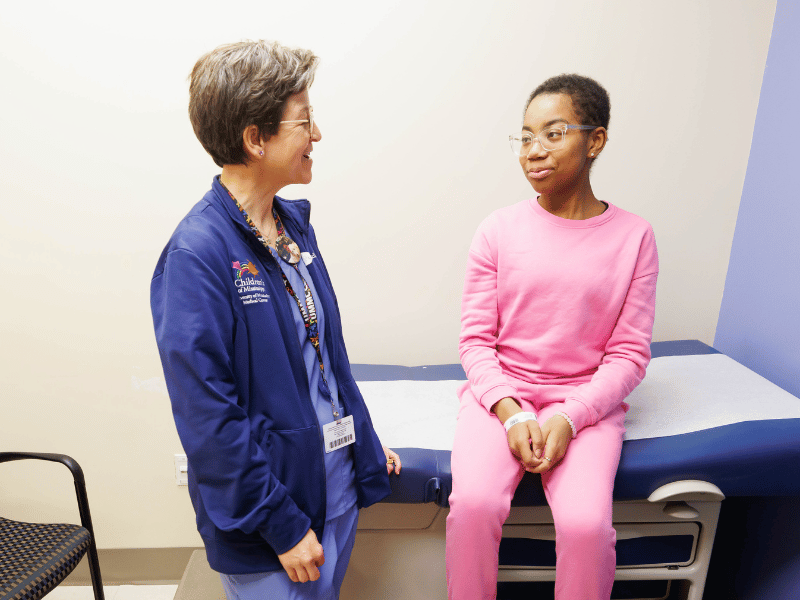 Dr. Melissa McNaull talks with Kennedi Jackson during a check-up at the Center for Cancer and Blood Disorders at Children's of Mississippi.