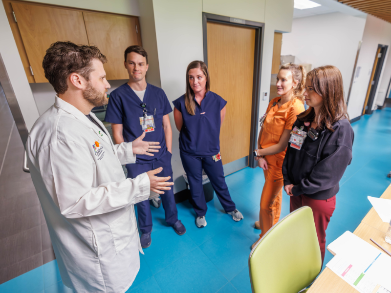 PICU nurse manager Gordon Gartrell, from left, talks with registered nurses Christian Dulaney, Emily Wade, Alexis Gaines and Haley Williams.