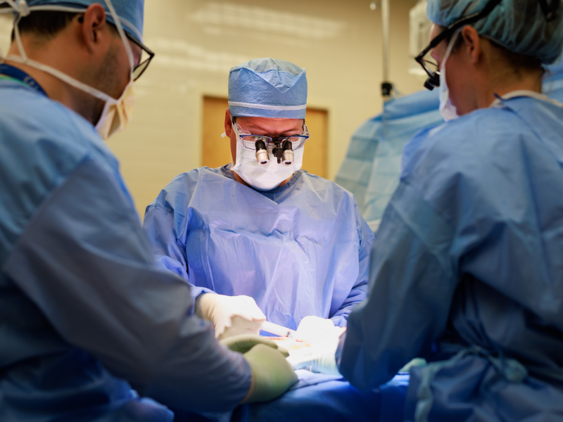 Dr. Marc Walker, director of The Jabaley-Songcharoen Center for Hand, Upper Extremity and Nerve Surgery, and surgical team operate on Trey Wheeler of Brandon.