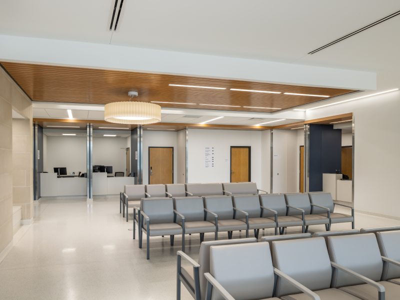 Seating area with front desks and chairs.