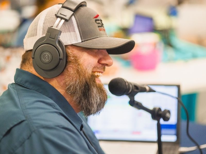 Nate West of US 96.3 laughs during the first day of Mississippi Miracles Radiothon broadcasting.