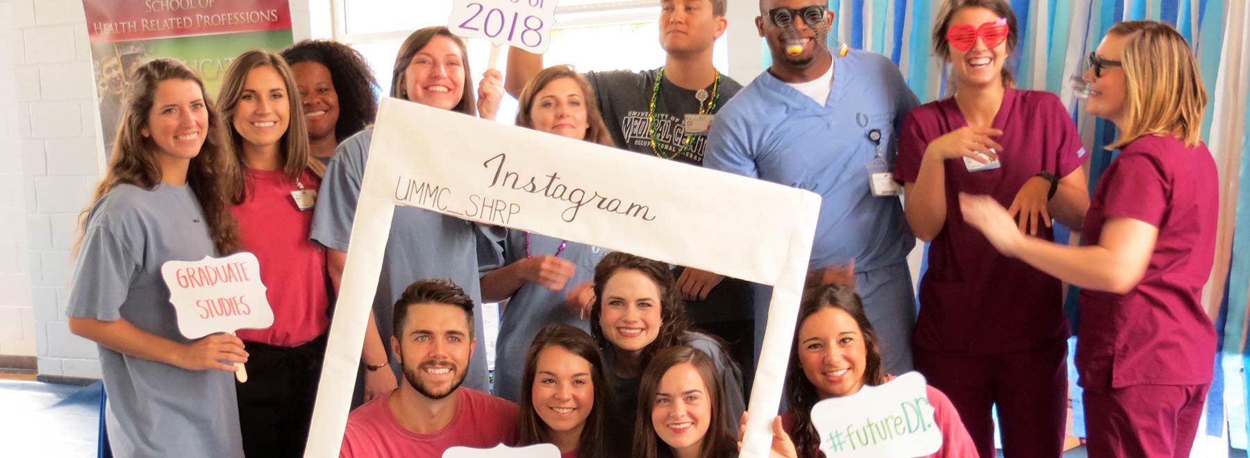 UMMC Alumni pose for a fun group picture.