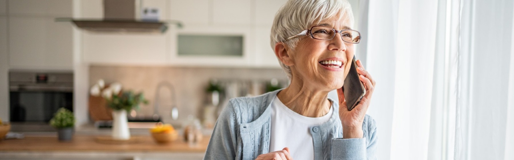 Woman smiles while talking on the phone. Woman smiles while talking on the phone.