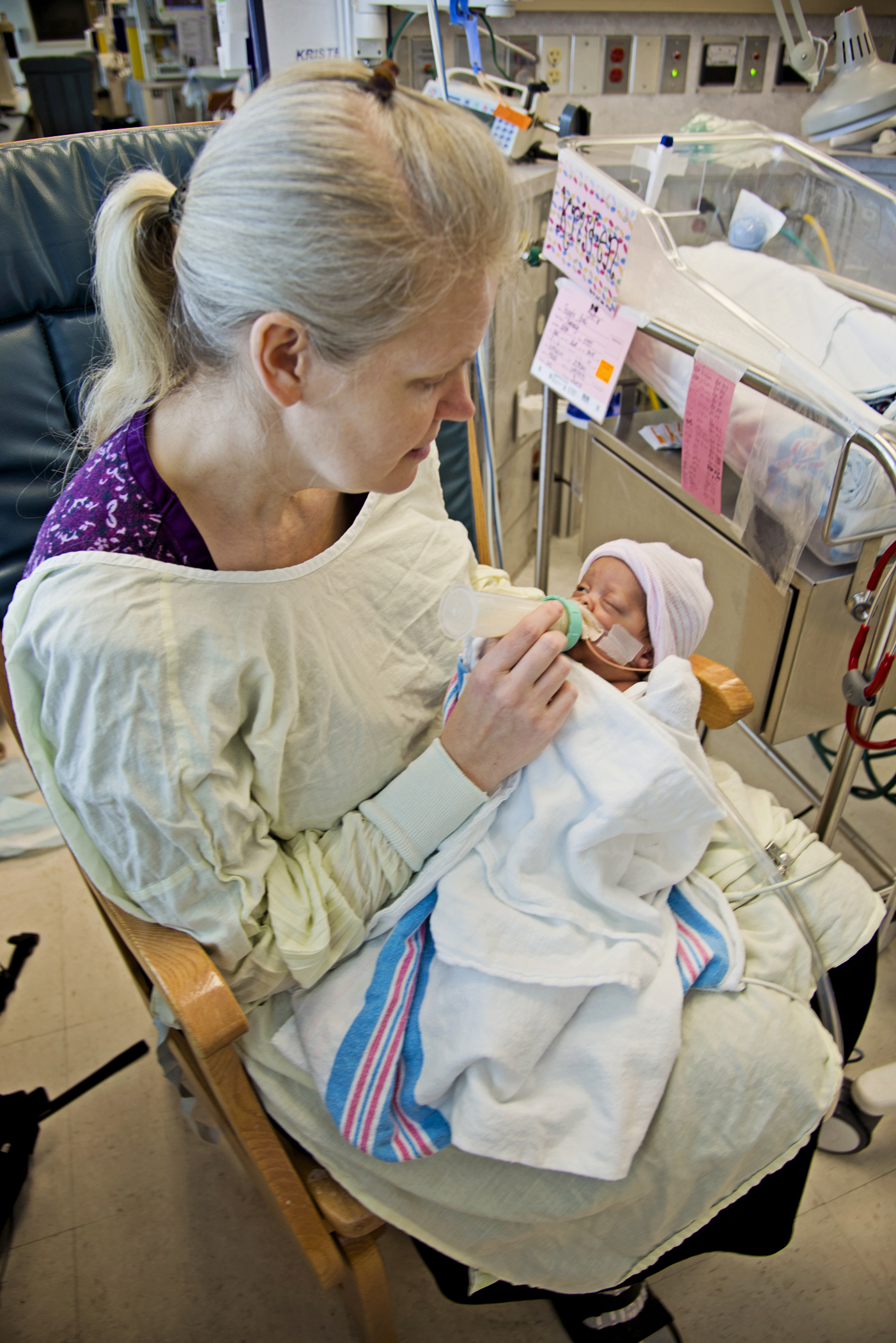 Kimberly Fugate gives Kristen, one of her four identical daughters, her first bottle in the Neonatal Intensive Care Unit at the University of Mississippi Medical Center.