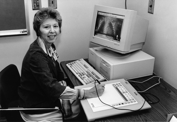 Ada Seltzer demonstrates an early computer program that displays an X-ray on the screen.