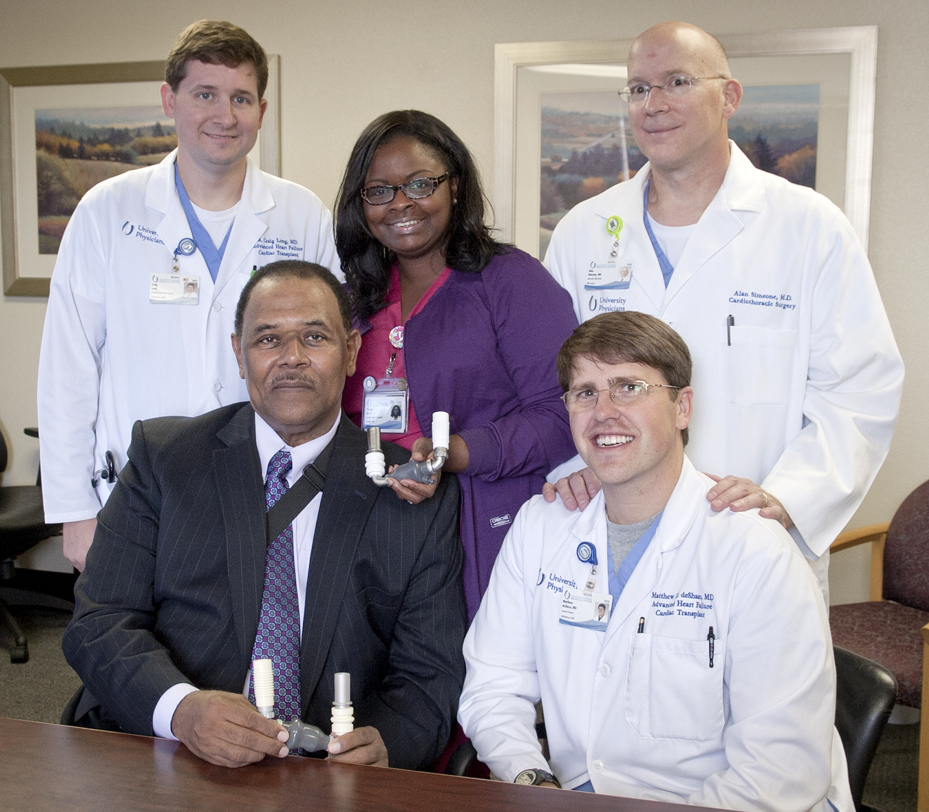 Jackson resident Harold Mayberry (bottom left), who in fall 2013 received a life-saving LVAD, or left ventricular assistance device, is cared for by a team of cardiologist and a cardiac surgeon who specialize in heart failure and heart transplantation. The team includes (bottom right) cardiac surgeon Dr. Alan Simeone; and (top, from left) heart failure specialist Dr. Craig Long; registered nurse and ventricular assistance device coordinator Yolanda Martin; and heart failure specialist Dr. Matt deShazo.
