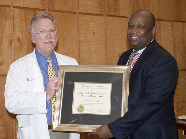 Dr. Gailen Marshall, UMMC professor of medicine and pediatrics and Vice Chair for Research in the Department of Medicine, left, poses with Dr. Ervin Fox, the 2015 Herbert Langford Research Mentor Award, professor of medicine, at the annual DOM Research Day event on March 31.