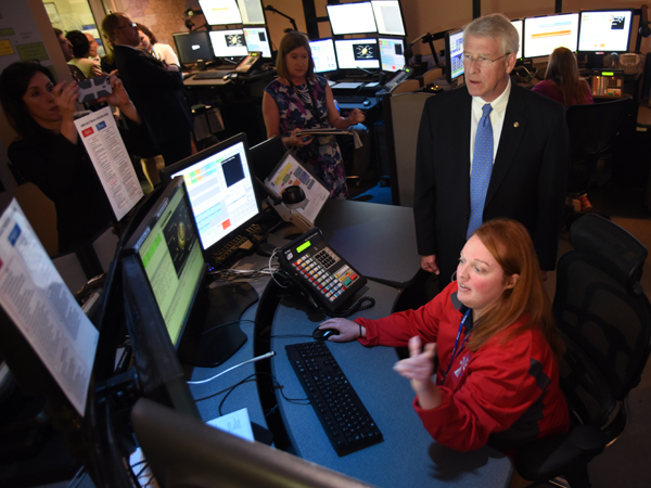 Samantha Tucker, a communications specialist at Mississippi MED-COM, explains to Sen. Wicker how she fields calls from emergency responders statewide.