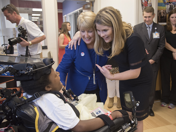 Deborah Bryant, wife of Mississippi Gov. Phil Bryant, and NBC special correspondent Jenna Bush Hager, right, daughter of 43rd President George W. Bush, chat with Batson Children's Hospital patient DeAsia Scott.