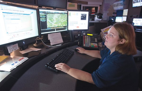 Samantha Tucker, communications specialist and dispatcher in the MED-COM emergency response center, keeps an eye on severe storms moving across Mississippi.