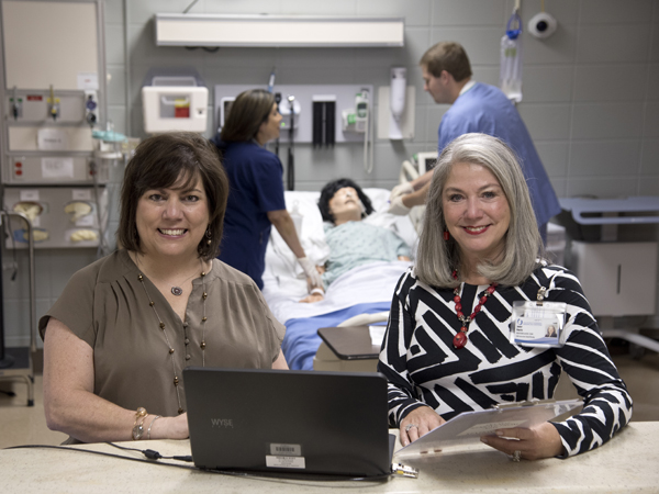 Dr. Robin Christian, left, and Dr. Janet Harris in the School of Nursing's simulation lab