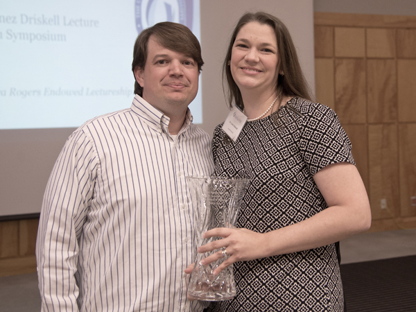 Josie and husband Lee Bidwell, assistant professor of biochemistry, celebrating her Alumnus of the Year honor.