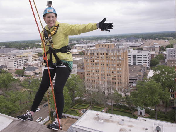 Maggie Hanberry stops to take in the view before rappelling 14 stories Saturday. She was heading up Team Maggie, which included her parents, a cousin and a family friend. The Hattiesburg group raised more than $7,200 for Friends of Children's Hospital in the fundraiser.
