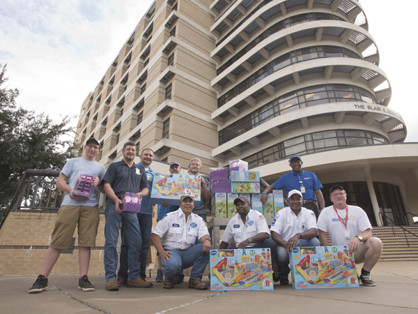 Delivering Walmart's donation of toys for Batson Children's Hospital are, from left, volunteer Joseph Miller and Walmart employees Marty Stroud, Anthony Thompson, Davis Lowery, Darel Wallace, Rickey Oliver, Charlie Collins, Ricky Sharpe, Billy Tingle and Tony Miller.