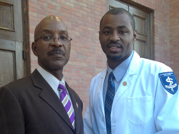 Nate in a picture with his father after receiving his white coat in 2015.