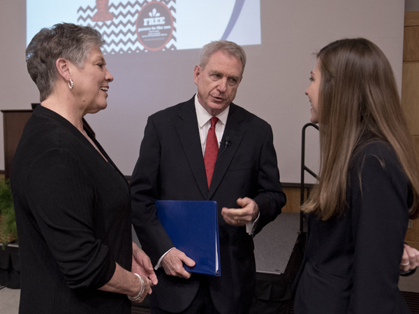 Jones, center, speaks with wife Lydia, left and M2 student Meagan Henry before the Last Lecture.