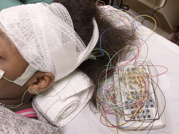 Gray is wired with leads for her EEG in the new Pediatric Neurophysiology Lab.