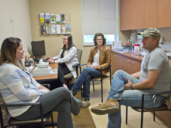 Lindsey and Brad chat with Gonzalez, and Renee Stoehr, the department's project manager.