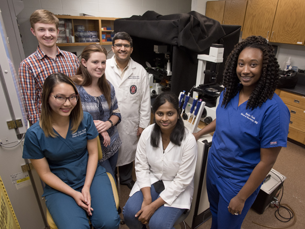 The Janorkar lab, front row from left: Quynh Chau Nguyen, D2; Gurumurthy; Kendra Clark, D3;  back row from left: Jared Cobb, Ph.D student; Sarah Fitzgerald, Ph.D. student; Janorkar.