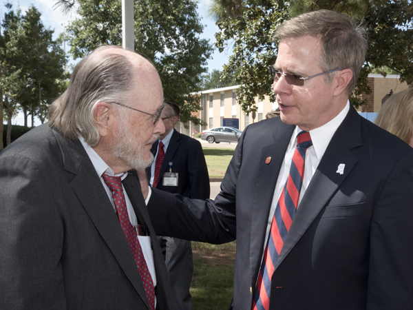 Dr. John Bower, left, visits with University of Mississippi Chancellor Jeffrey Vitter at the naming ceremony of the John D. Bower School of Population Health.