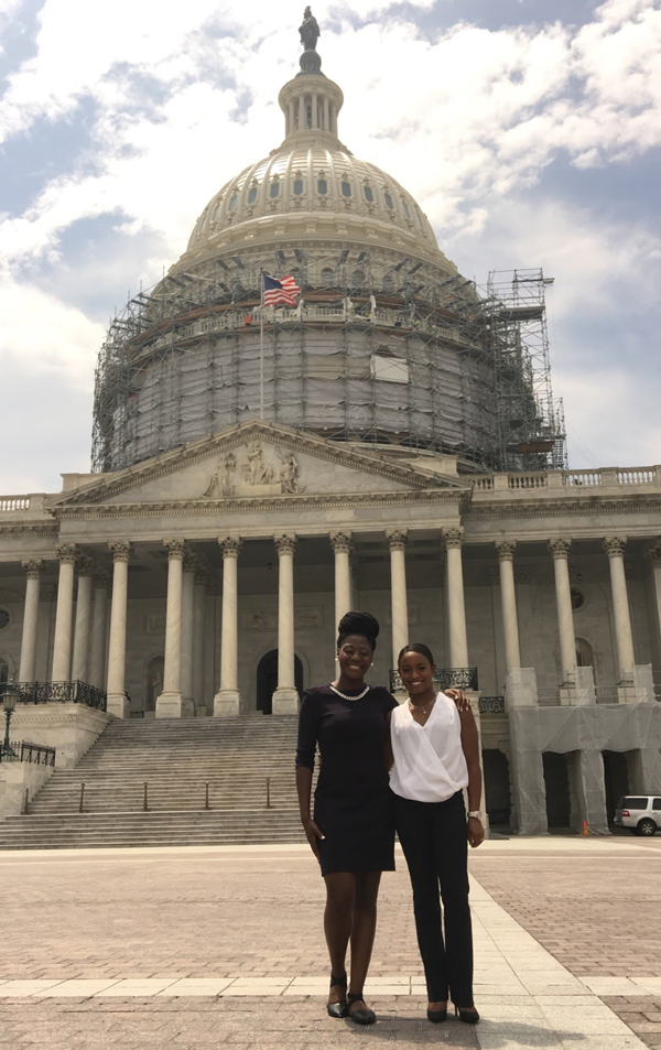 Among the students who were awarded fellowships to the RESULTS International Conference in Washington, D.C., in June are Nneamaka Ezekwe, left, and Morgan Davis, who visited the U.S. Capitol in the midst of a dome renovation project.