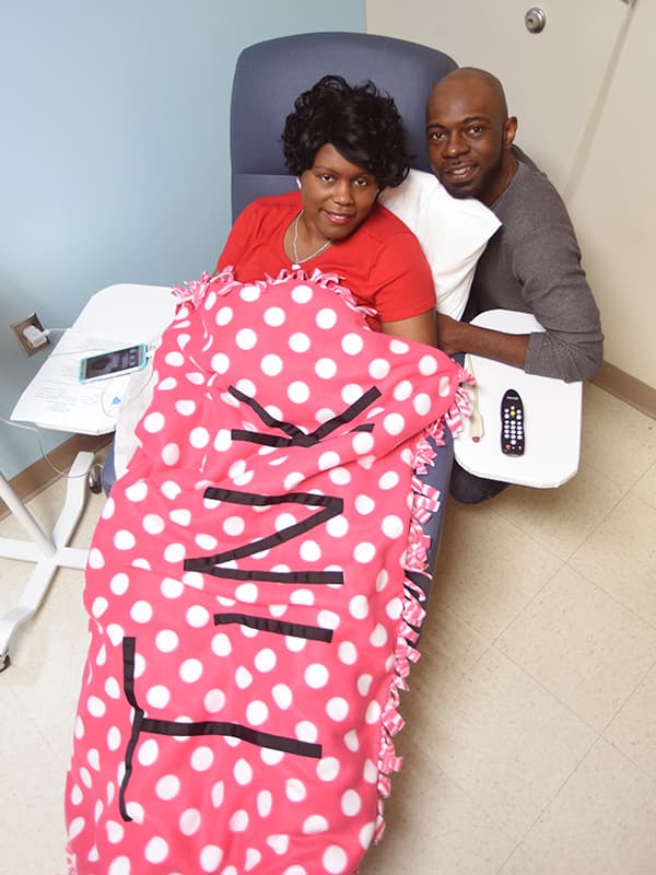 Anitrus Robinson and her husband, Joey, go Pink for Tink as she receives chemotherapy at the UMMC Cancer Institute Outpatient Clinic.