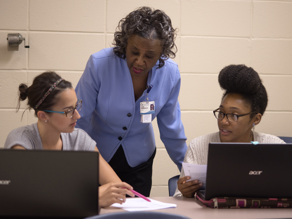 Northington said she sets high standards for her students because nurses have the responsibility of another person's life in their hands. She is pictured here with students in the accelerated nursing class, Taylor-Alice WcWllams, left, and Courtney Swhoops.