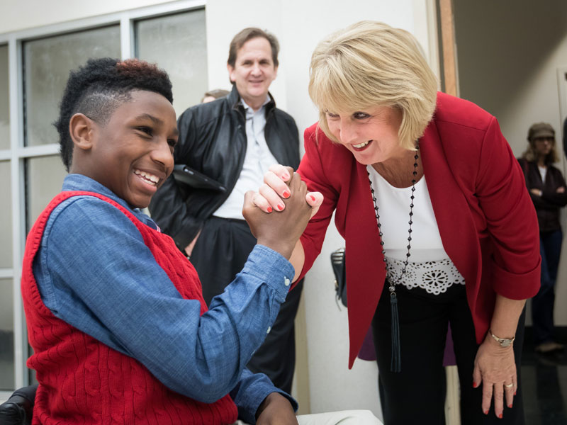 Batson Children's Hospital patient K.J. Fields gets a handshake from Mississippi First Lady Deborah Bryant at BankPlus Presents Light A Light, a Friends of Children's Hospital fundraiser. The two shared the honor of lighting the hospital's Christmas tree during the event.