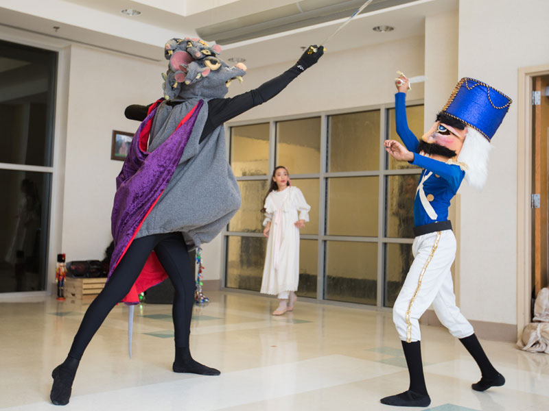 The Mouse King (Chole Butler) and Nutcracker (Wilton McDowell) battle in a scene from the traditional holiday ballet, presented by Ballet Mississippi.