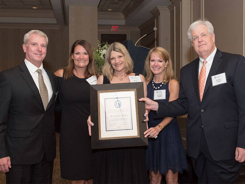 Dr. Connie McCaa's family celebrated her induction into the UMMC Medical Alumni Chapter Hall of Fame this past August at the Medical Alumni Chapter Awards Dinner. From the left, Andy McCaa (Robert Andrew McCaa), Lois McCaa Bradford, Melanie McCaa Stewart and Gayle McCaa Watters. They were joined by Dr. Bruce Longest, then-president of the Medical Alumni Chapter. 