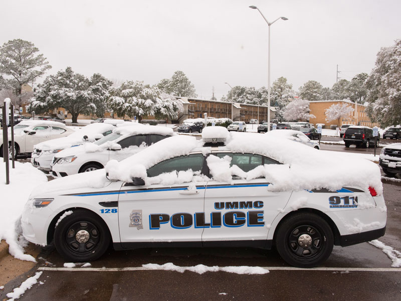 Campus police cruisers "chillin'" in the parking lot.