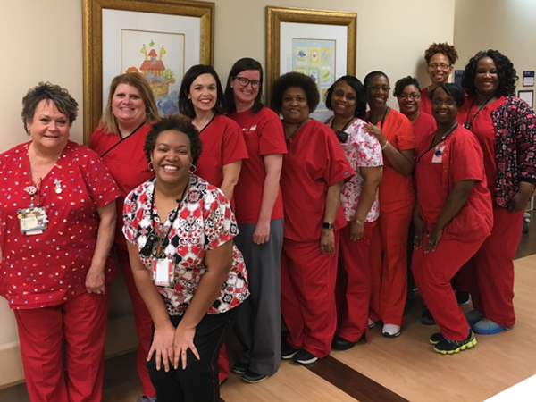 Herndon, fourth from left, posted this picture of the Mother-Baby Unit and WIC office in the People of the U Facebook group on Go Red for Women Day.