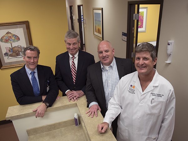 Smiling at the opening of the new Children's of Mississippi specialty clinic on the Gulf Coast are, from left, Dr. Rick Barr and Dr. John Purvis from UMMC and Dr. Mark Lee and Dr. Brad Troutman, who will practice at the clinic, located in Biloxi's Cedar Lake area.
