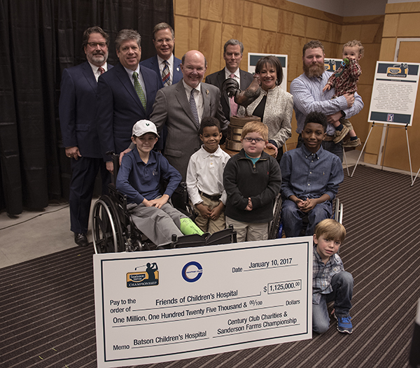 Smiling with the $1.125 million donation to Friends of Children's Hospital are Batson Children's Hospital patients, front, from left, Felton Walker, De'Nahri Middleton, Blake Stone, K.J. Fields, Tucker Jones (kneeling), and Jamie Beck, held by dad Carson Beck. Looking on are, from left, Marks, Jent, Vitter, Sanderson, and Ray.