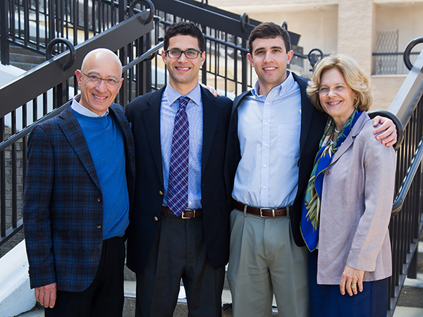 Celebrating with Robbie are his brother, Marco, second from right, an M3 at UMMC, and his parents, Dr. Giorgio Aru, UMMC professor of surgery and chief of thoracic surgery, and Jan Aru, a UMMC RN in ambulatory surgery.