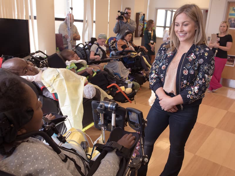   Gymnast, author and television personality Shawn Johnson East talks with DeAsia Scott and other patients during a visit Tuesday to Batson Children's Hospital.
