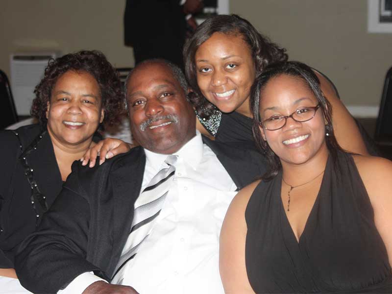 Moore, right, savors a moment with her family, from left: mom Hazel Pittman, dad Lynn Pittman and sister Roshanda Deboise.