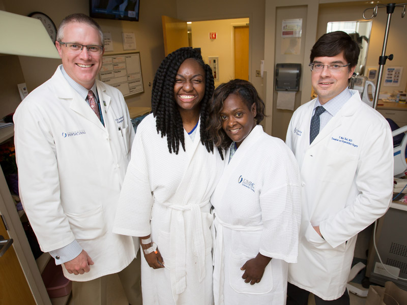 Dr. Christopher Anderson, left, and Dr. Mark Earl, right, performed the Medical Center's first split liver transplant in April 2017 in which patients Bettina Dixon, second from left, and Roda Barnes shared a donor liver. Joe Ellis/ UMMC Communications 