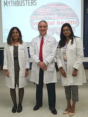 UMMC faculty Dr. Philip Merideth, professor of psychiatry, and adult psychiatry residents Dr. Prathyusha Vangala, left, and Dr. Afifa Adiba gave teens critical information on mental health during the "Mythbusters" workshop.