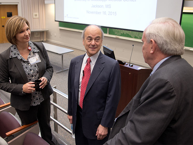Dr. LouAnn Woodward, vice chancellor for health affairs, and Dr. Michael Henderson, chief medical officer, visited with The Join Commission's Dr. Mark Chassin (center) before his grand rounds presentation in 2015.